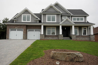 Traditional two-story wood exterior home idea in Other