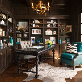 Inspiration for a traditional study room in Dallas with brown walls, dark hardwood floors, a freestanding desk and brown floor.
