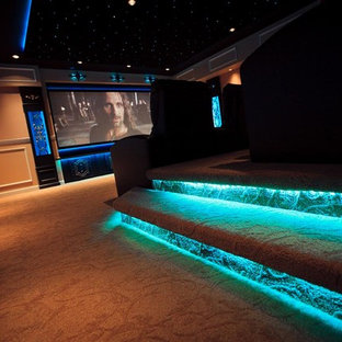 Design ideas for a medium sized classic enclosed home cinema in Grand Rapids with beige walls, carpet and a projector screen.
