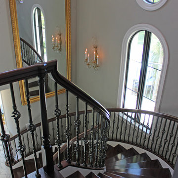 Walnut Circular Stair with Twist & Basket Iron Balusters