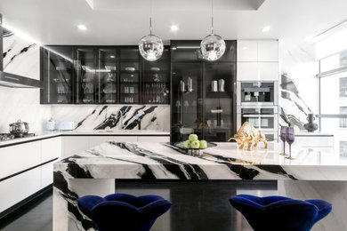 Eat-in kitchen - large modern eat-in kitchen idea in Los Angeles with flat-panel cabinets and an island