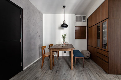 Inspiration for a small modern dining room in Hong Kong with white walls, ceramic flooring and grey floors.