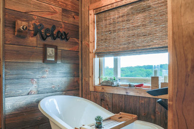Example of a mid-sized mountain style master travertine tile porcelain tile and gray floor bathroom design in Omaha with recessed-panel cabinets, beige walls, an undermount sink, onyx countertops and white countertops