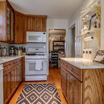 Open shelving and a galley orientation maximize the kitchen's storage potential.