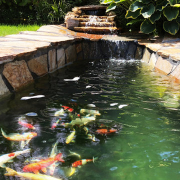 Koi pond installation with flagstone patio