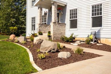 Inspiration for a large full sun front yard mulch landscaping in Other for summer.