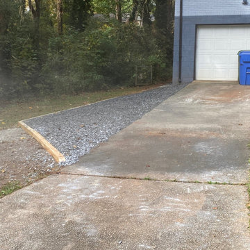 Slate rock driveway and slate rock walkway to the basement.