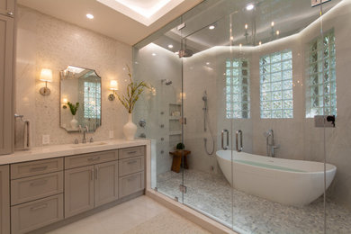 Inspiration for a large transitional master white tile and porcelain tile porcelain tile, white floor and single-sink bathroom remodel in Miami with shaker cabinets, gray cabinets, a two-piece toilet, white walls, an undermount sink, quartz countertops, a hinged shower door, white countertops and a built-in vanity