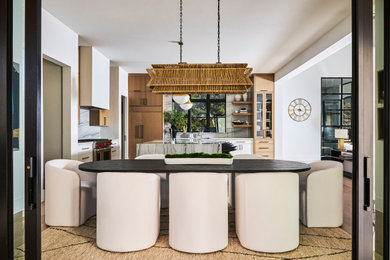 Inspiration for a mid-sized mediterranean light wood floor kitchen/dining room combo remodel in Dallas with white walls
