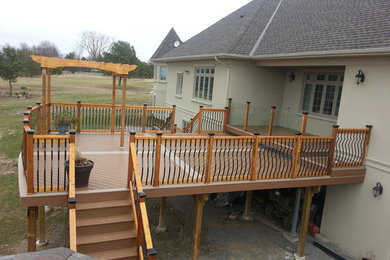 Photo of an expansive traditional backyard deck in Toronto with no cover.