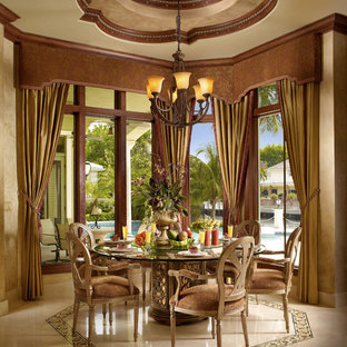 This is an example of a mid-sized mediterranean open plan dining in Miami with beige walls, marble floors, beige floor and no fireplace.