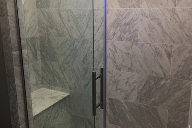 Example of a classic stone tile ceramic tile bathroom design in Salt Lake City with gray walls