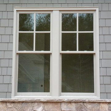 Stone, shake, arches, columns, board and batten