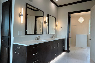 Inspiration for a large modern master double-sink bathroom remodel in Austin with flat-panel cabinets, black cabinets, quartz countertops and a built-in vanity
