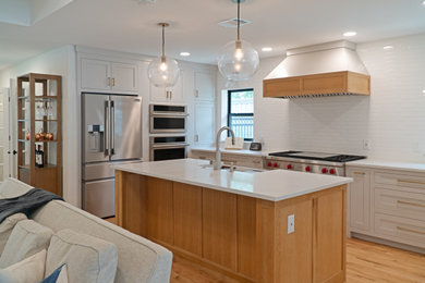 Example of a transitional kitchen design in Dallas with beaded inset cabinets, beige cabinets, quartz countertops, white backsplash, an island and white countertops