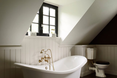 Example of a classic master bathroom design in Other with a two-piece toilet