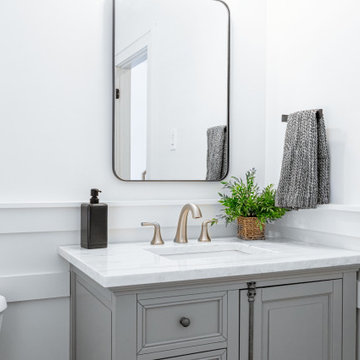 Transitional Powder Room – Custom Wainscoting and Matte Black Accents