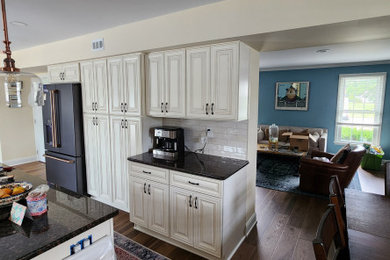 Large elegant galley eat-in kitchen photo in Philadelphia with an island