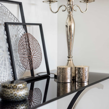 Styling detail on black glass console
