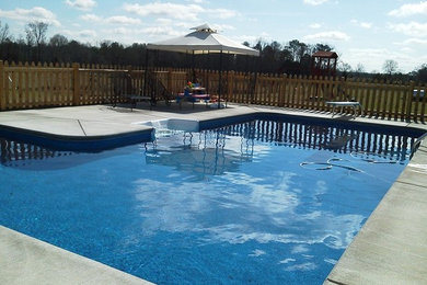Inspiration for a mid-sized indoor l-shaped pool remodel in Atlanta