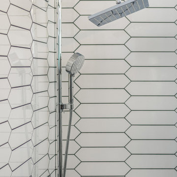 White Decorative Shower Tile With Chrome Fixtures