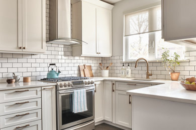 Small minimalist u-shaped porcelain tile and gray floor eat-in kitchen photo in New York with an undermount sink, shaker cabinets, white cabinets, quartzite countertops, white backsplash, subway tile backsplash, stainless steel appliances, no island and white countertops