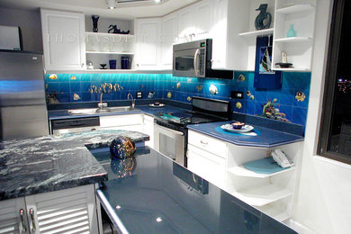 Inspiration for a large tropical l-shaped kitchen pantry remodel in Hawaii with a drop-in sink