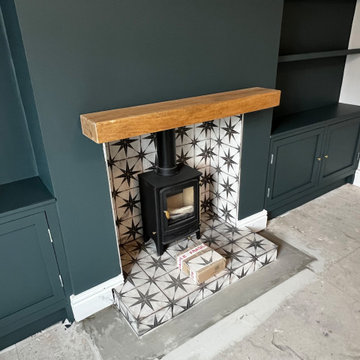 Feature log burner, tiled hearth and wooden mantelpiece AFTER