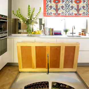 Example of a mid-sized transitional home design design in London