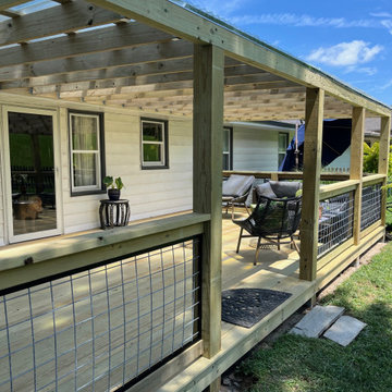Covered Ground-Level Deck in Lake Waukomis, MO