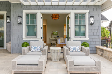 Example of a beach style patio design in Denver