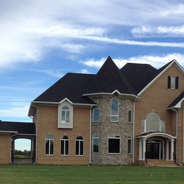 Front Exterior Full Brick House With Stone and Dryvit