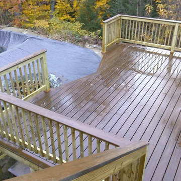 This Pool Deck in New Boston, NH gives access to the pool with separate deck abo