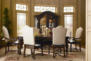 This is an example of a large traditional separate dining room in New York with beige walls, medium hardwood floors, no fireplace and brown floor.