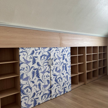 Custom Built-In Bookshelf with Blue Chinoiserie Sliding Panels