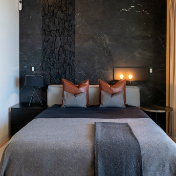 Master Suite with Dark Stone Wall and Grey Bed, Lisbon