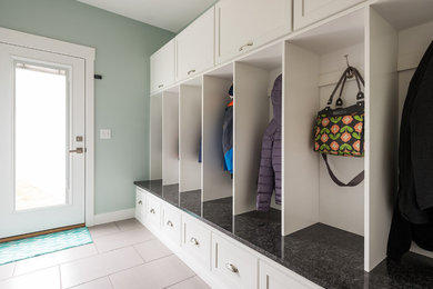 Inspiration for a large transitional porcelain tile mudroom remodel in Salt Lake City