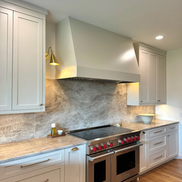 Frameless white perimeter with rift cut oak islands