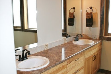 Freestanding bathtub - large contemporary master beige tile and ceramic tile ceramic tile freestanding bathtub idea in Vancouver with shaker cabinets, light wood cabinets, a two-piece toilet, beige walls, a drop-in sink and granite countertops