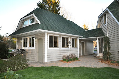 Mid-sized elegant attached garage workshop photo in Grand Rapids
