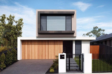 Photo of a contemporary two-storey concrete white exterior in Melbourne with a flat roof.