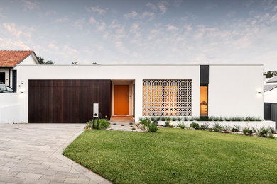 Contemporary one-storey white house exterior in Perth with mixed siding and a flat roof.