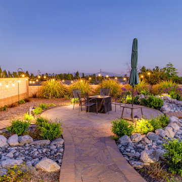 Backyard Patio with Spacious Lawn & Dry Stream Bed