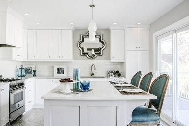 Example of a transitional kitchen design in Calgary