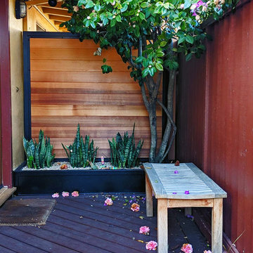 Secured Custom Steel Framed Gates with Slab Accent Garden Wall