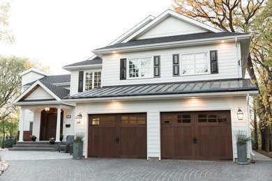 Large traditional white two-story wood exterior home idea in Other with a shingle roof