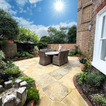 Small Italian Courtyard inspired garden in with new York stonen