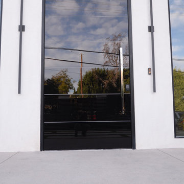 Custom Frameless Black Laminated Glass Oversized Pivot Door