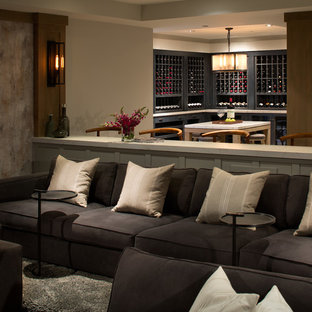 This is an example of a large classic open plan home cinema in San Diego with grey walls.