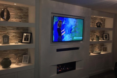 Tv & fireplace wall with shelving